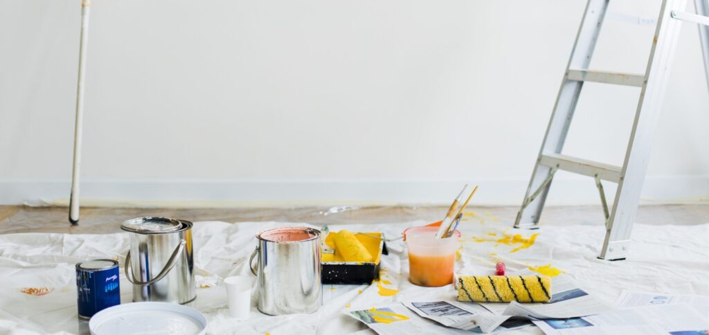 paint-and-roller-and-a-ladder-sitting-in-a-room